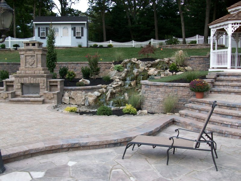 backyard fireplace with retaining walls